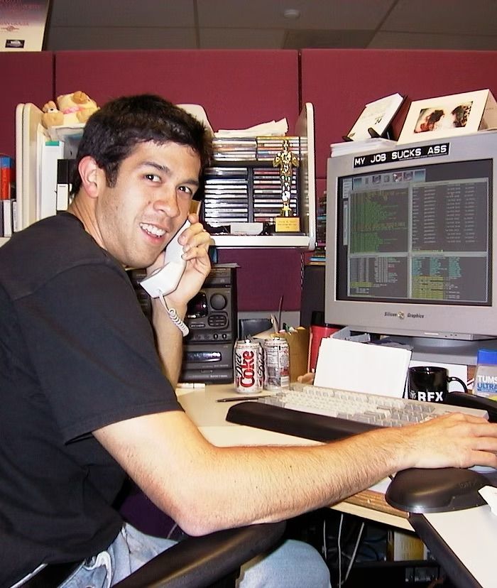 A young Darin Grant at his desk at Digital Domain around 1999, on the phone in front of a Silicon Graphics workstation